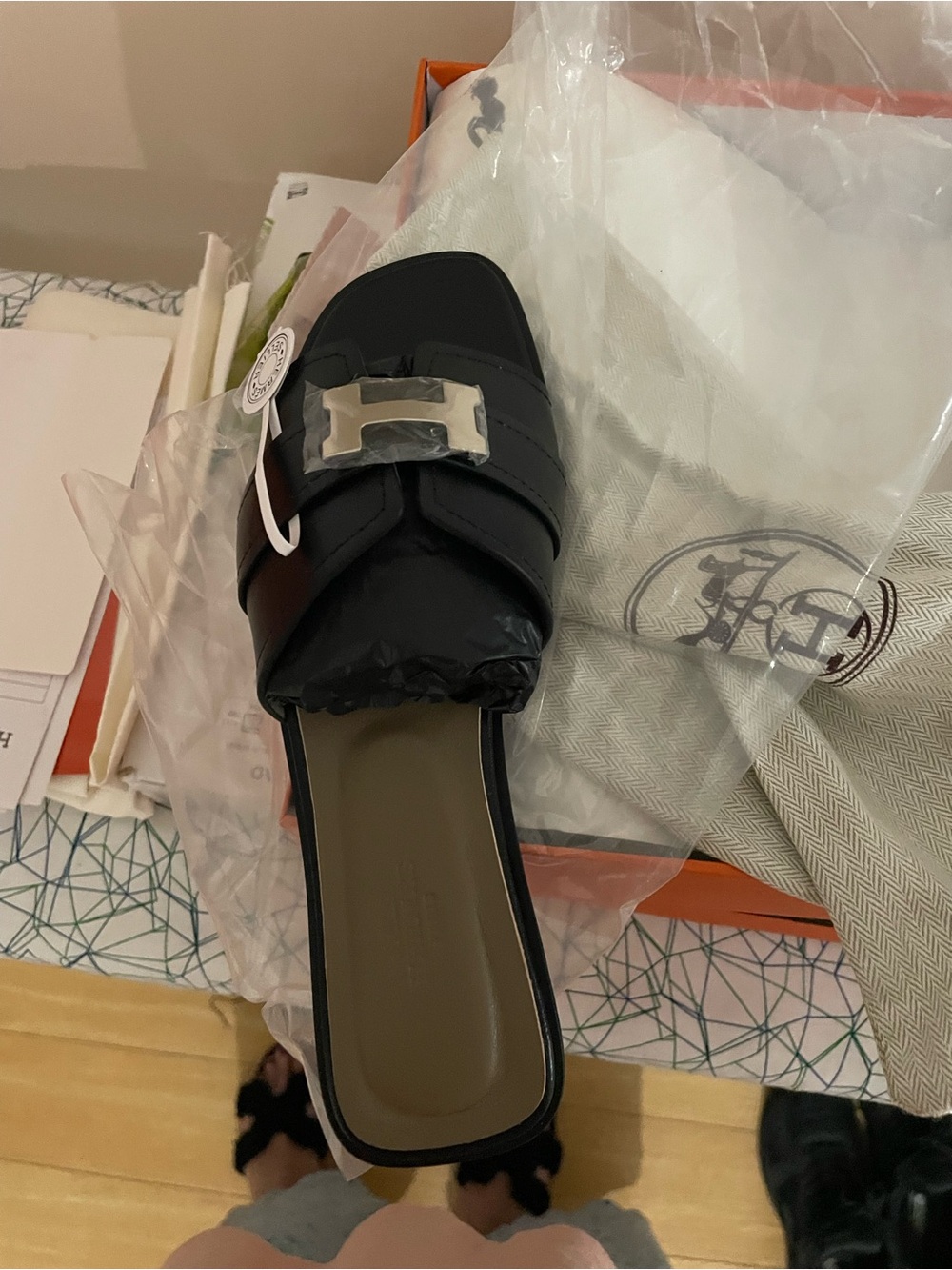 Hermes Black Leather Slide Sandal with Silver H Buckle it’s the copy